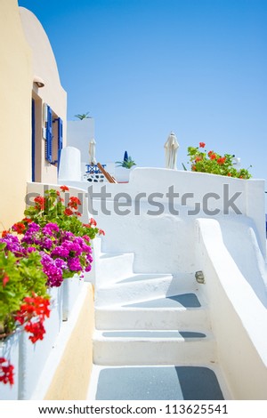White old staircase and flowers at Santorini island,Greece