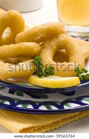 Spanish tapas. Fried squid rings. Typical appetizer. Selective focus. Closeup. Calamares a la romana.