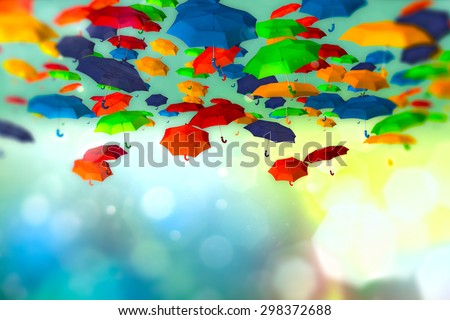 Colored umbrellas in the sky on bokeh background