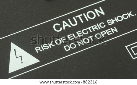 close-up of warning: risk of electric shock