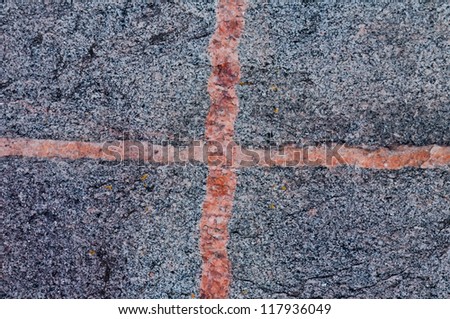 Granite with red cross on the surface beautiful background