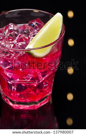 Red Campari Cocktail in short glass with lemon decoration