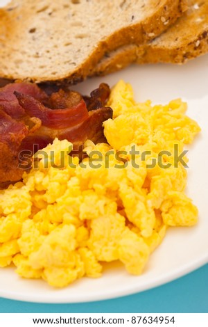 American breakfast, bacon and scrambled egg, close up shoot