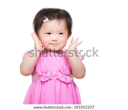 Asia little girl with hand on face
