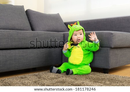 Baby with dinosaur halloween party costume