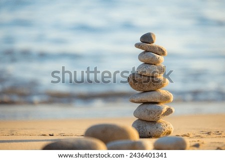 Similar – Image, Stock Photo Stones stacked on the beach, harmonious and balanced