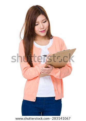 Woman take note on clipboard