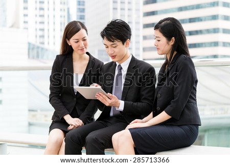 Group of business people use of tablet pc together