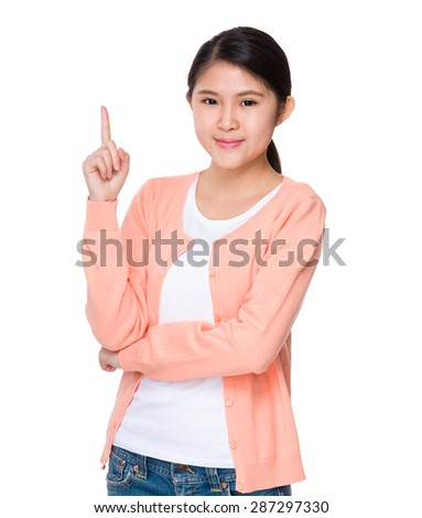 Young student with finger pointing up