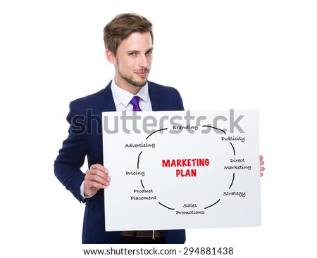 Businessman hold with white board showing marketing planning
