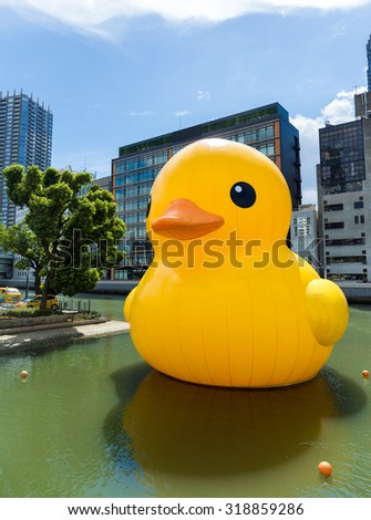 Japan Osaka - September 19: The rubber duck swim in Nakanoshima park on September 19 2015. Giant \'Rubber Duck\' Sculpture By Artist Florentijn Hofman, visit Osaka which draw the attention of local.