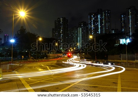 High traffic road with motion blurred automobile