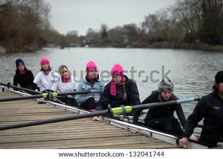 OXFORD - MAR 8: Oxford university students sitting in a boat during Torpids races on March 8, 2013 in Oxford, England. Torpids are one of annually three races with more than 1,200 participants.