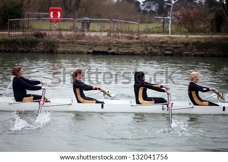 OXFORD - MAR 8: Oxford university students rowing during Torpids races on March 8, 2013 in Oxford, England. Torpids are one of annually three races with more than 1,200 participants.
