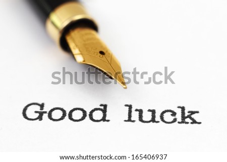 Fountain pen on good luck text