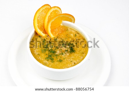 Hot soup with vegetables and meat with orange
