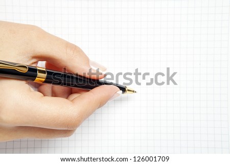 Pen in hand Isolated on white background