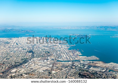 Aerial view of the Suburbs of San Francisco with clouds blanketing the Ocean and Coastline