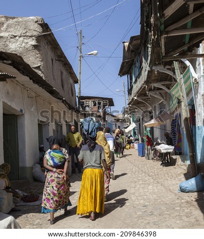 HARAR, ETHIOPIA - DECEMBER 24, 2013: Unidentified people of ancient walled city of Jugol in their daily routine activities that almost unchanged in more than four hundred years.