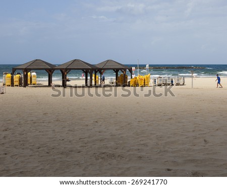 TEM AVIV, ISRAEL - OCTOBER 19, 2014: Geula Beach. Despite hot weather, October in Israel considered a shoulder season, so beaches are not packed too much.