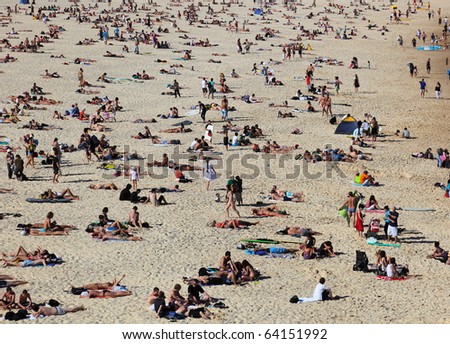 SYDNEY - NOVEMBER 02: The first hot summer day. People sunbath on Sydney famous Bondi Beach. November 15, 2009 in Sydney, Australia