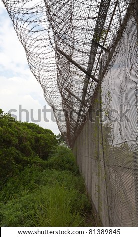 Barbed wire fence on border with China. Mai Po. Hong Kong. Zdjęcia stock © 