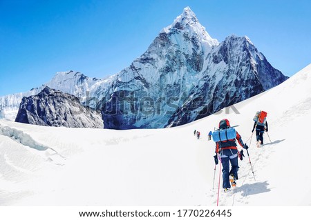 Group of climbers reaching the Everest summit in Nepal. 