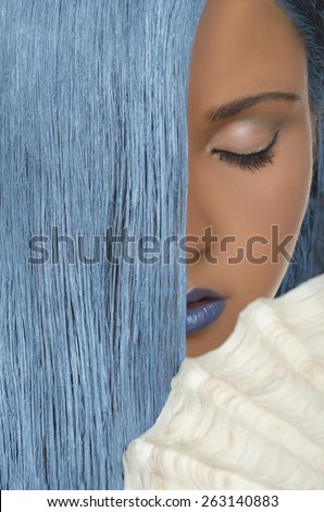 Portrait of beautiful woman with straight blue hair, shells and closed eyes