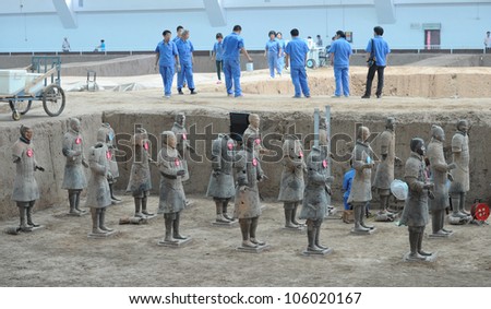 LINTONG - MAY 8: Chinese archaeologists restart excavation and research of the famous terracotta army figures on May 8, 2012 in Lintong, China. Until this date excavation has halted for 10 years.
