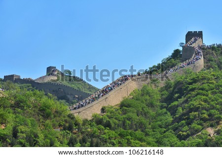 BEIJING - OCTOBER 1: crowds of people travel during National Day holiday on October 1, 2011 in Beijing, China. At this time tourist sites are overcrowded with people, like here on the Great Wall.