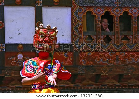 BHUTAN - APRIL 15: A dancer with colorful mask dances at a yearly festival called Tsechu to celebrate Buddhism on April 15, 2010 in Bhutan.