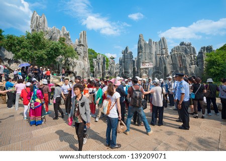 KUNMING - OCT 1: crowd of people travel during national holiday on October 1, 2012 in Kunming, China. More than 20.000 people visit sites like the Kunming Stone Forest daily.