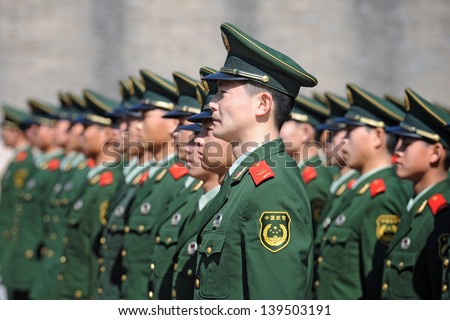 BEIJING - NOV 8: Soldiers stand guard in Tiananmen area during China\'s 18th National Congress on November 8, 2012 in Beijing, China.Security is extra tight because of leadership transition.