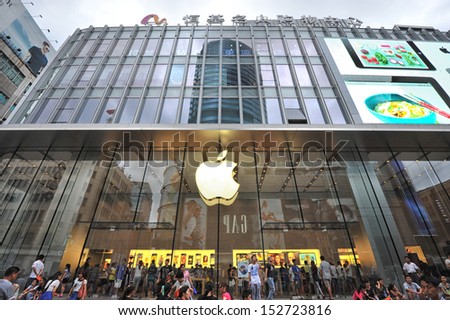 SHANGHAI - AUG 22: people walking in front of Apple store on Nanjing road on August 22, 2013 in Shanghai, China.This store is one of several stand-alone flagship Apple stores in high-profile locations