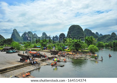 GUILIN - OCTOBER 2: Bamboo rafts on the Li river during national holiday on October 2, 2013 in Guilin, China. During this holiday period around 80.000 people visit the Guilin area daily.