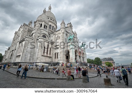 PARIS - JULY 20: tourists at the Basilica of the Sacred Heart on July 20, 2015 in Paris, France. In year 2014 more than 15 million people visited Paris.