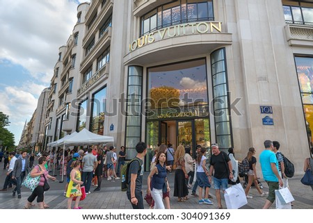PARIS - JULY 20: people waiting  in front of Louis Vuitton store on July 20, 2015 in Paris, France. The company is one of the world\'s leading fashion houses with more than 460 stores worldwide.
