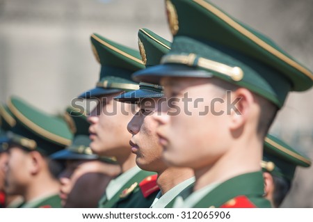 BEIJING - NOV 8: Chinese soldiers attend a parade at Tiananmen square on November 8, 2012 in Beijing, China. The Chinese army is the largest in the world, with a strength of around 2,285,000 soldiers.