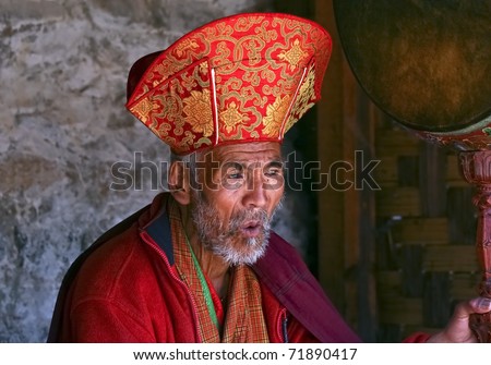 BHUTAN - APRIL 15: A unidentified Buddhist priest oversees the yearly Buddhist mask dance festival called Tsechu on April 15, 2008 in Bhutan.