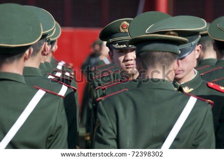 BEIJING - APRIL 2: Chinese soldiers prepare for the national flag ceremony on April 2, 2010 in Beijing, China. Here officers inspect soldiers.