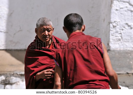 SHIGATSE, TIBET- JUNE 5: Unidentified monks debate in the Tashilunpo monastery area on JUNE 5, 2010 in Shigatse, Tibet. Debating is part of the monastery curriculum to become a higher lama.