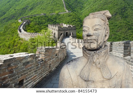 Ancient Chinese terracotta warrior against Great Wall background (wonders of the world and the two major creations of the first emperor Qin Shihuang)