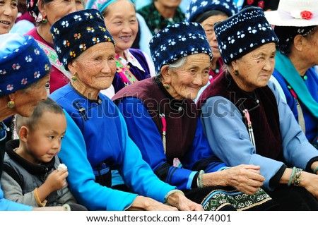 DALI, CHINA - SEPTEMBER 12: Unidentified Chinese women attend Mid-Autumn festival on 12 September, 2011 in Dali, China. This is China\'s popular annual harvest festival celebrating the year\'s harvest.