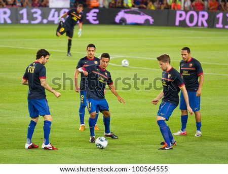 BARCELONA - AUGUST 17: Barcelona players warm-up before the Spanish Super Cup final match between FC Barcelona and Real Madrid, 3 - 2, on August 17, 2011 in Camp Nou stadium, Barcelona, Spain.