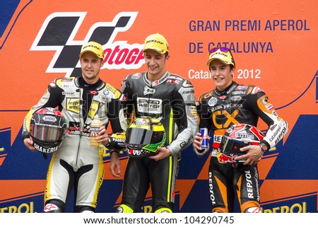 BARCELONA - JUNE 3: Thomas Luthi (2nd), Andrea Iannone (1st) and Marc Marquez (3rd) (L-R) in the podium after the race of Moto2 Grand Prix of Catalunya, on June 3, 2012 in Barcelona, Spain.