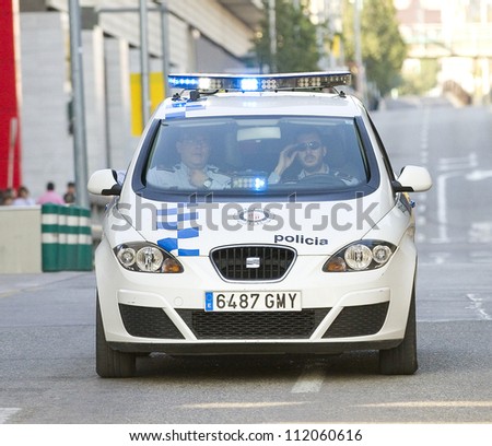 BARCELONA, SPAIN - MARCH 24: Police car during Volta a Catalunya cycling race, on March 24, 2012, in Barcelona, Spain.