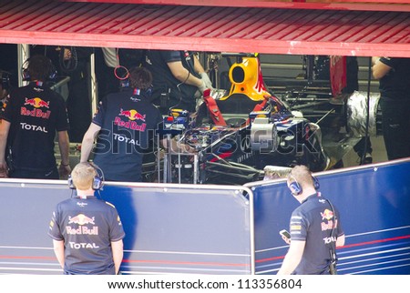 BARCELONA - FEBRUARY 24: Red Bull car in the pit during Formula One Teams Test Days at Catalunya circuit on February 24, 2012 in Barcelona, Spain.