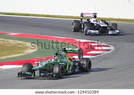BARCELONA - FEBRUARY 19: Charles Pic (L) racing with his new Caterham CT03 at Formula One Teams Test Days at Catalunya circuit on February 19, 2013 in Montmelo, Barcelona, Spain.