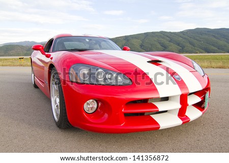 LA SEU D\'URGELL, SPAIN - OCTOBER 6: A Dodge Viper SRT take part in Road and Track racing weekend organized by American Car Club, on October 6, 2012, in the airport of La Seu d\'Urgell, Spain.