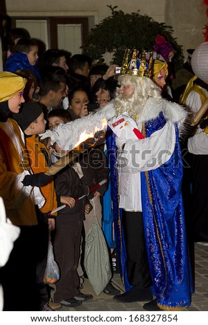 BARCELONA - JANUARY 5: Melchior King at the Biblical Magi Three Wise Men parade, who give toys to the children. Is a traditional spanish celebration. January 5, 2012 in Alella, Barcelona, Spain.